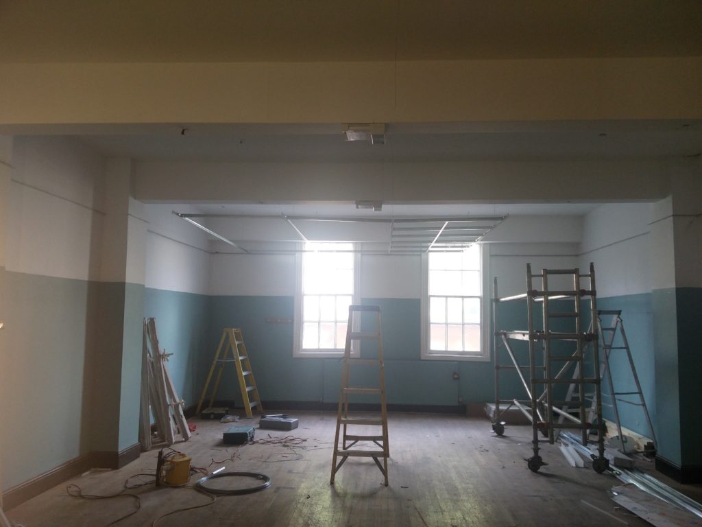 Part of a false ceiling being put up