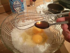 The vanilla extract about to be poured into the mix