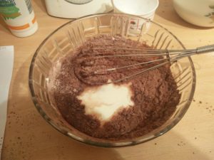 The cocoa flour, egg mix and buttermilk all being mixed together