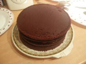 The top layer of the cake has been put on