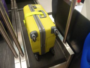 Mt green case on the conveyor belt after being checked-in