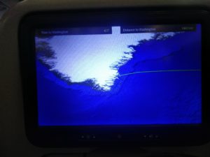 The flight map over Greenland showing how much distance is left to travel