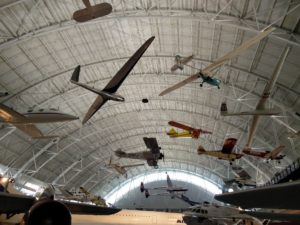 A variety of planes hanging from the ceiling