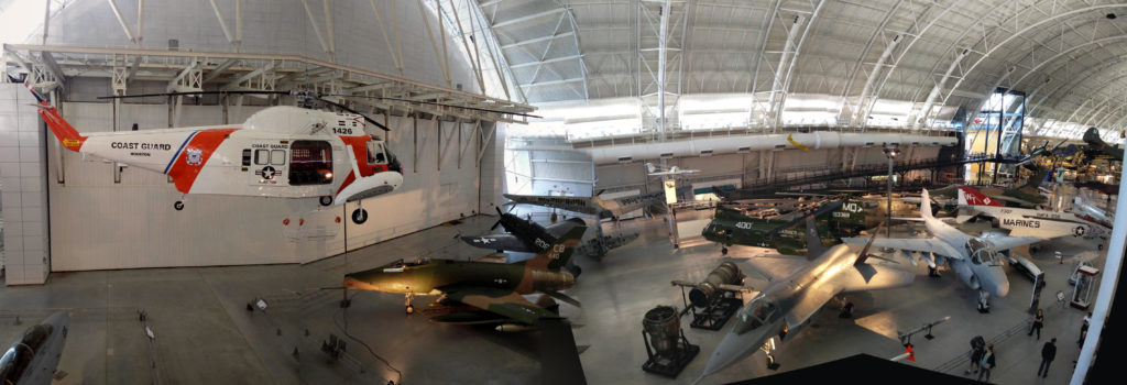 A panoramic view of part of the museum, showing various planes and helicopters